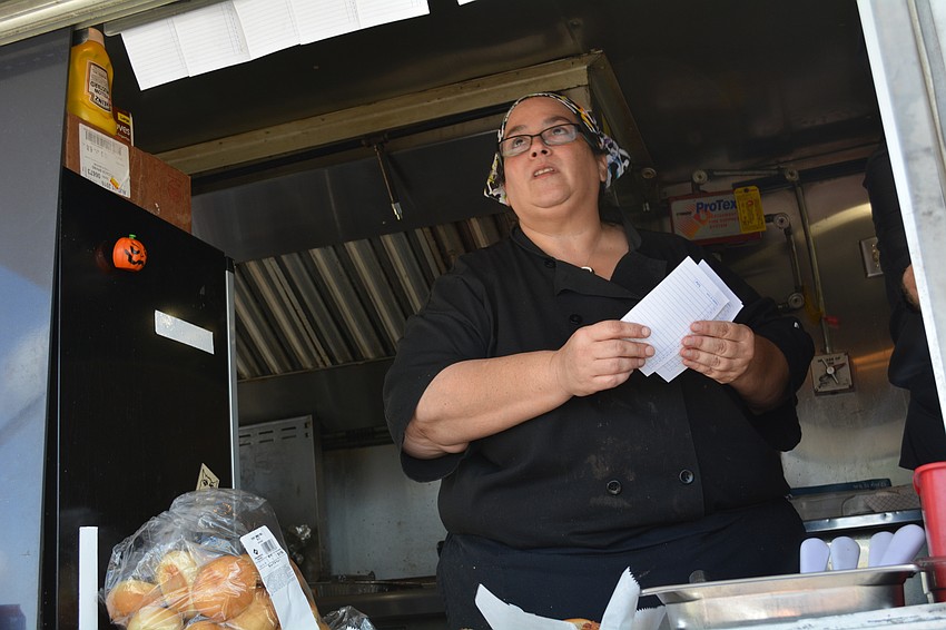 Lee Cagalotti, owner and chef of The Ravenous Rhino, serves up prime rib sliders and other specialties.