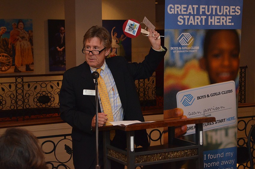 Boys and Girls Clubs of Sarasota County Vice President for Advancement Michael Doyle encourages attendees to raise their paddles and donate to the organization.