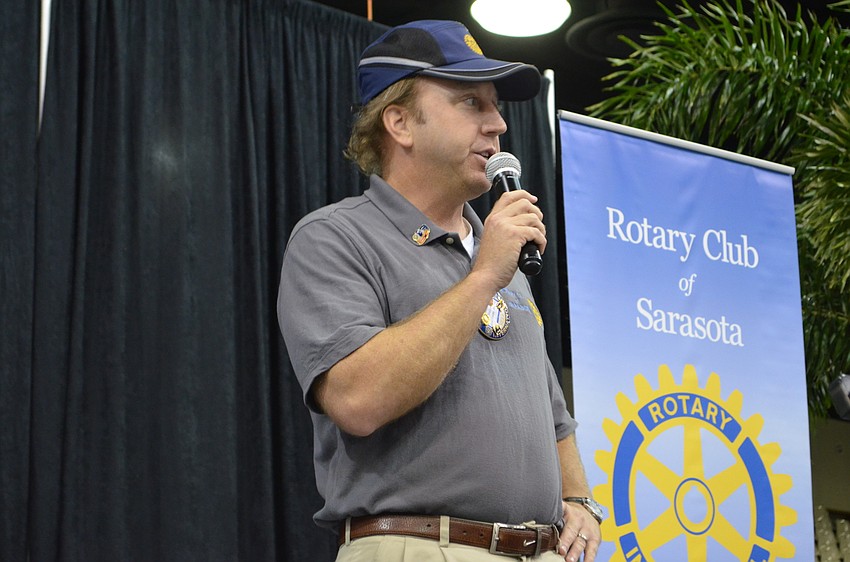 Rotary Club of Sarasota President Ben Bates welcomes guests to the 44th annual Pioneer Picnic at Robarts Arena.
