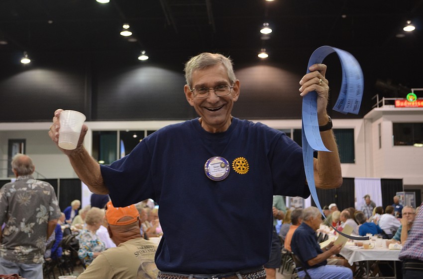 Rotarian Sean Skinner helps to sell raffle tickets