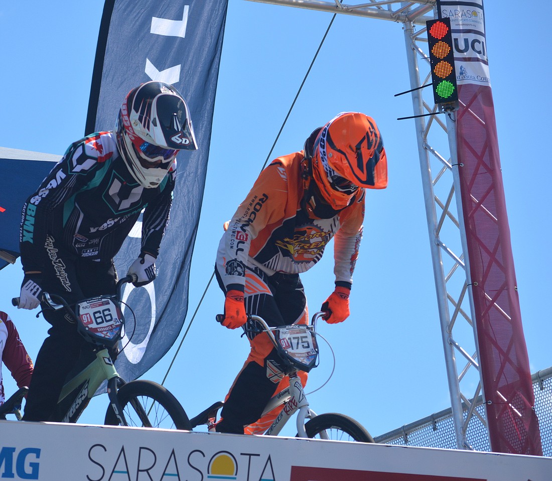Canada's James Palmer and the USA's Jeremy Smith prepare to launch out of the gate during the 2016 UCI BMX Supercross World Cup race in Sarasota.