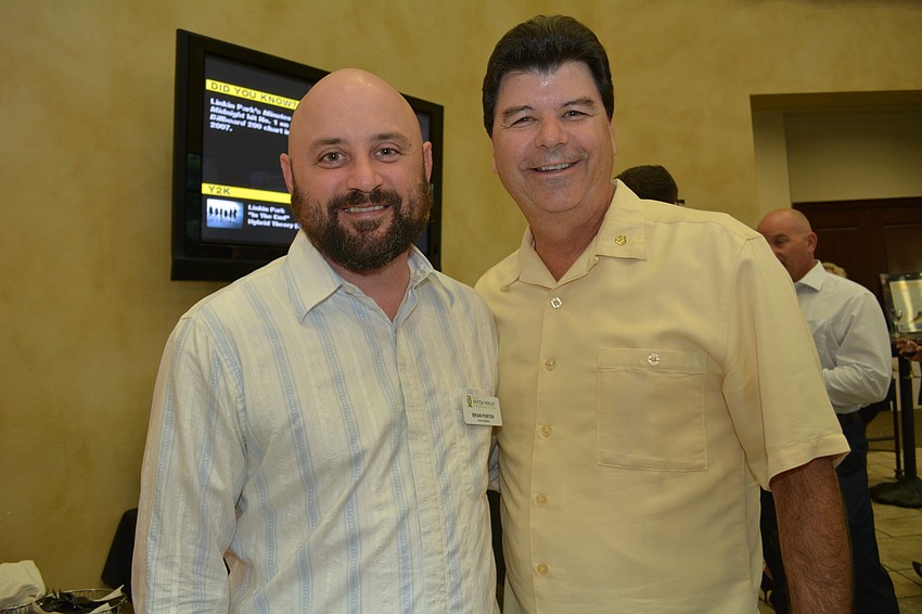 Heritage Harbour's Brian Porter, Payton Wright's uncle, poses with foundation supporter Steve Bordes, of Lakewood Ranch.