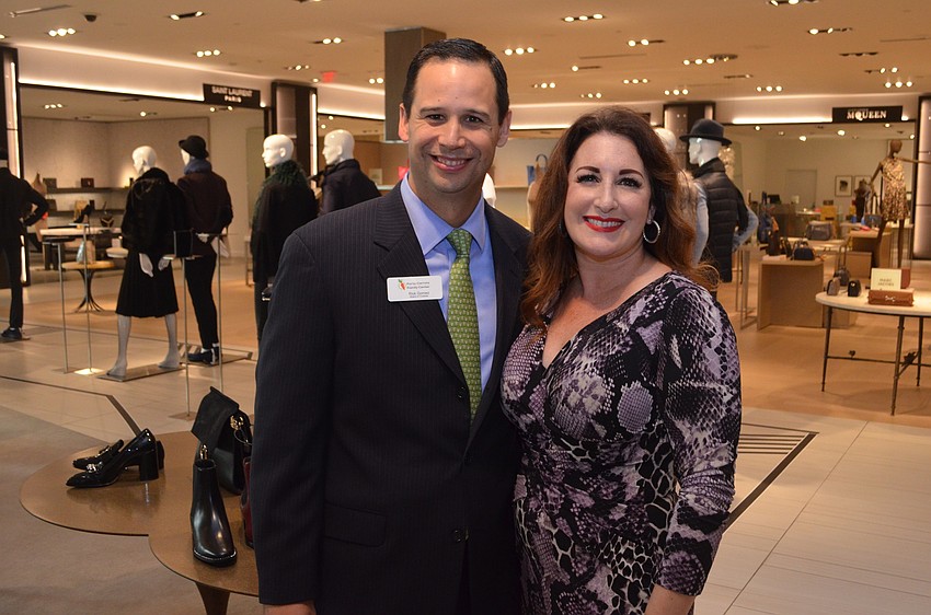 Chair of the Forty Carrots Board of Trustees Rick Gomez with Saks Fifth Avenue General Manager Terri Najmolhoda