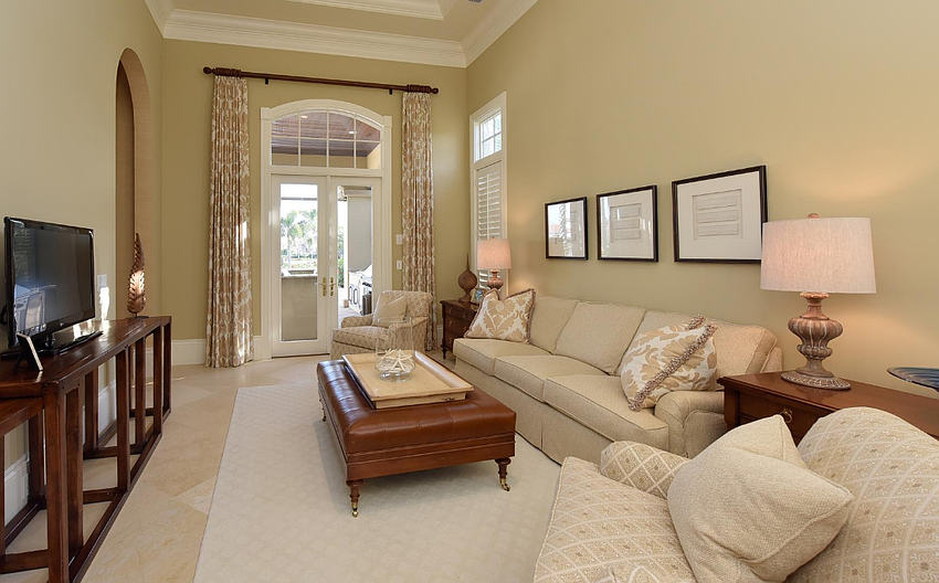 Graceful aches, soaring ceilings and 12-inch baseboard and crown show the attention to detail.