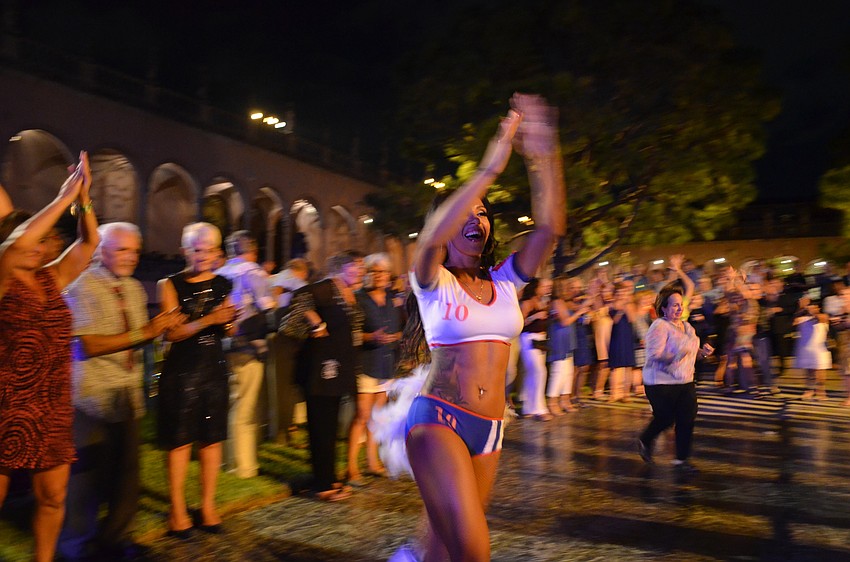 Dancers lead the crowd.