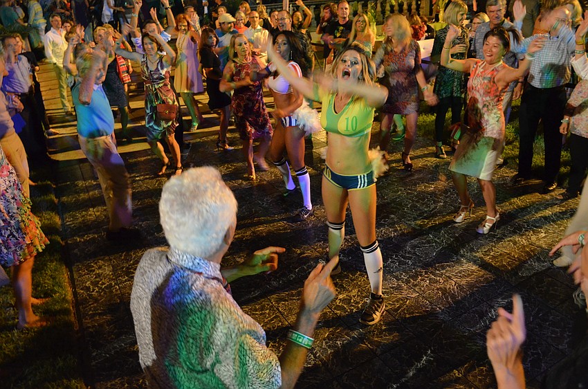 Dancers lead the crowd.