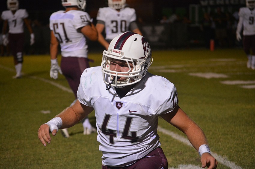 Braden River senior linebacker Matthew Haftke  gets to his feet after defending a pass during the Pirates' 42-35 loss to Venice.