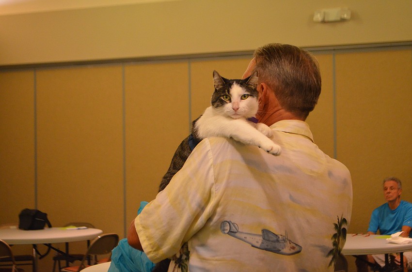 Acorn, 2, gets a lift from owner Dan Ehrbar.