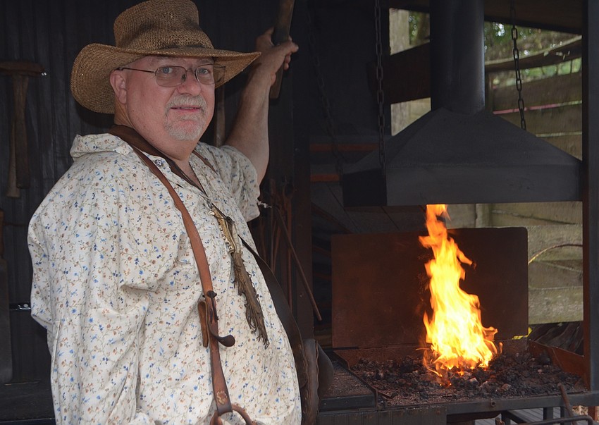 Paul Esterline of Manchester, Ga., sparked the entertainment by showing his blacksmith skills.