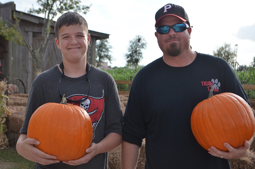 Parrish's Aaron Davis, 14, and his dad, Josh Davis, picked some perfect pumpkins.