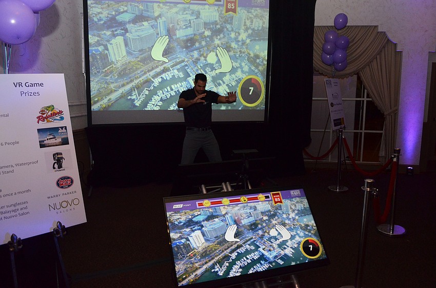 Marcus Stokes of Blue Pony demonstrates the company’s game, the Catch Challenge.