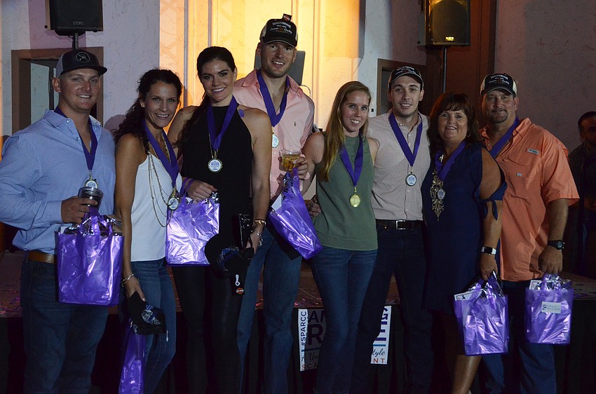 John Karl, Sarah Albritton, Heather Messenger, Miles Messenger and Charlene Parrish of winning team Da Fruit Crew pose after receiving their medals.