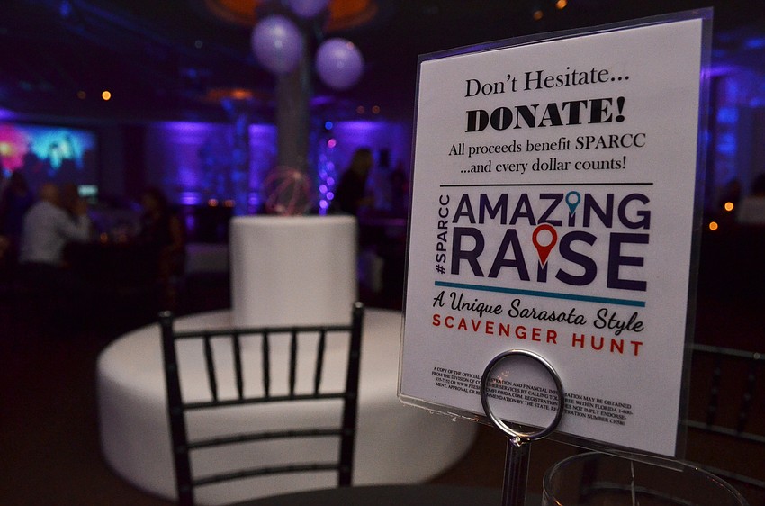 Tables remain empty as the event staff of Michael’s On East ballroom await attendees.