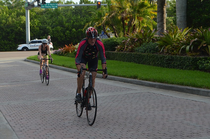 Participants turn into the Longboat Key Club to complete the biking portion of the triathlon.