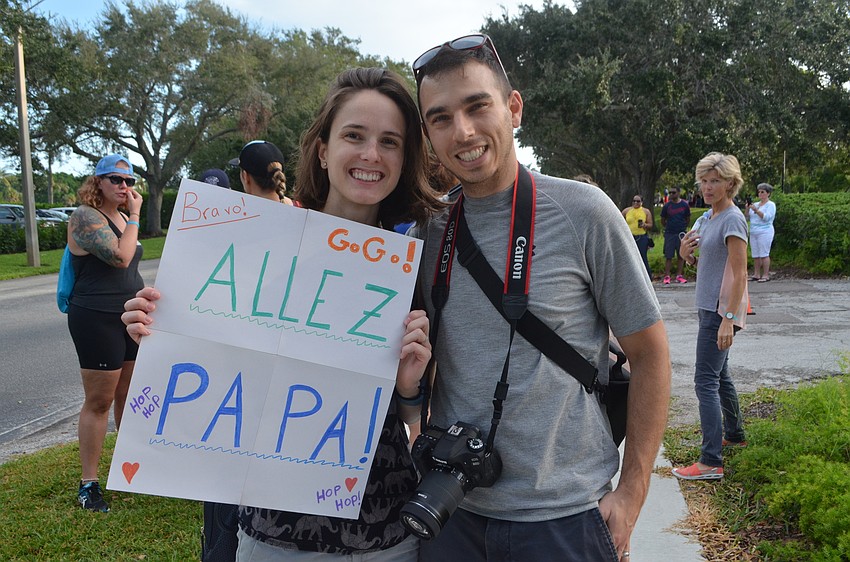 Sophie and Daniel Weintroub cheer on Sophie’s father, Emanuel Charron.