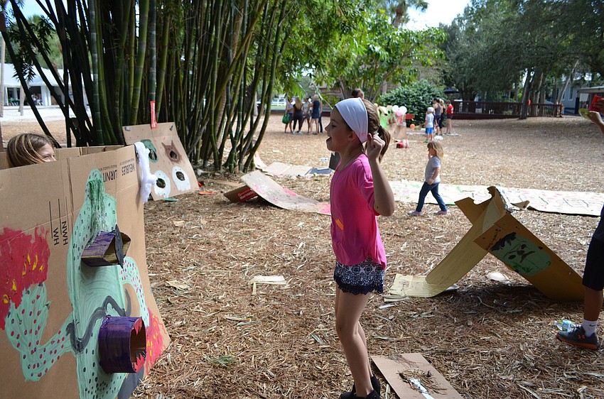 Addy celebrates winning tickets during the Out-of-Door Academy Cardboard Challenge.