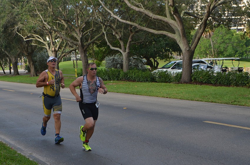 Runners approach the end of their first lap during the Longboat Key Triathlon.