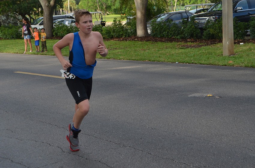 Gavin Putnal of Sarasota runs during the Longboat Key Triathlon on Oct. 16.