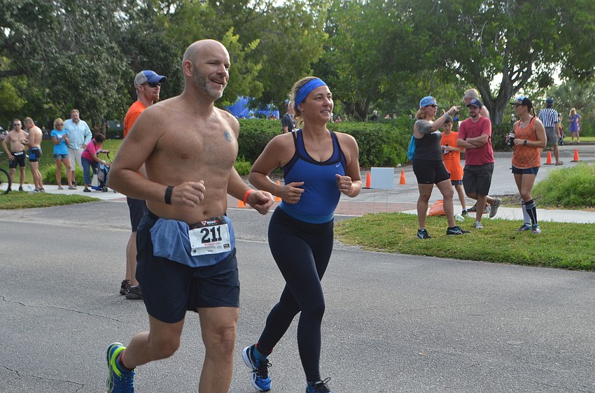 Participants are all smiles during the running portion of the Longboat Key Triathlon.