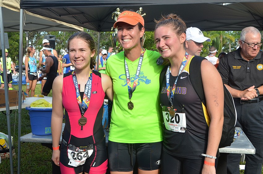 Top finishers of the women’s duathlon Olympic division Grace Szarko, Holly Chamberlain, and Kylee Bernthisel