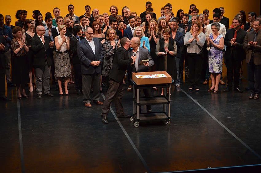 Company Director Iain Webb surprises Ballet Master Pavel Fomin with a belated 75th birthday cake.