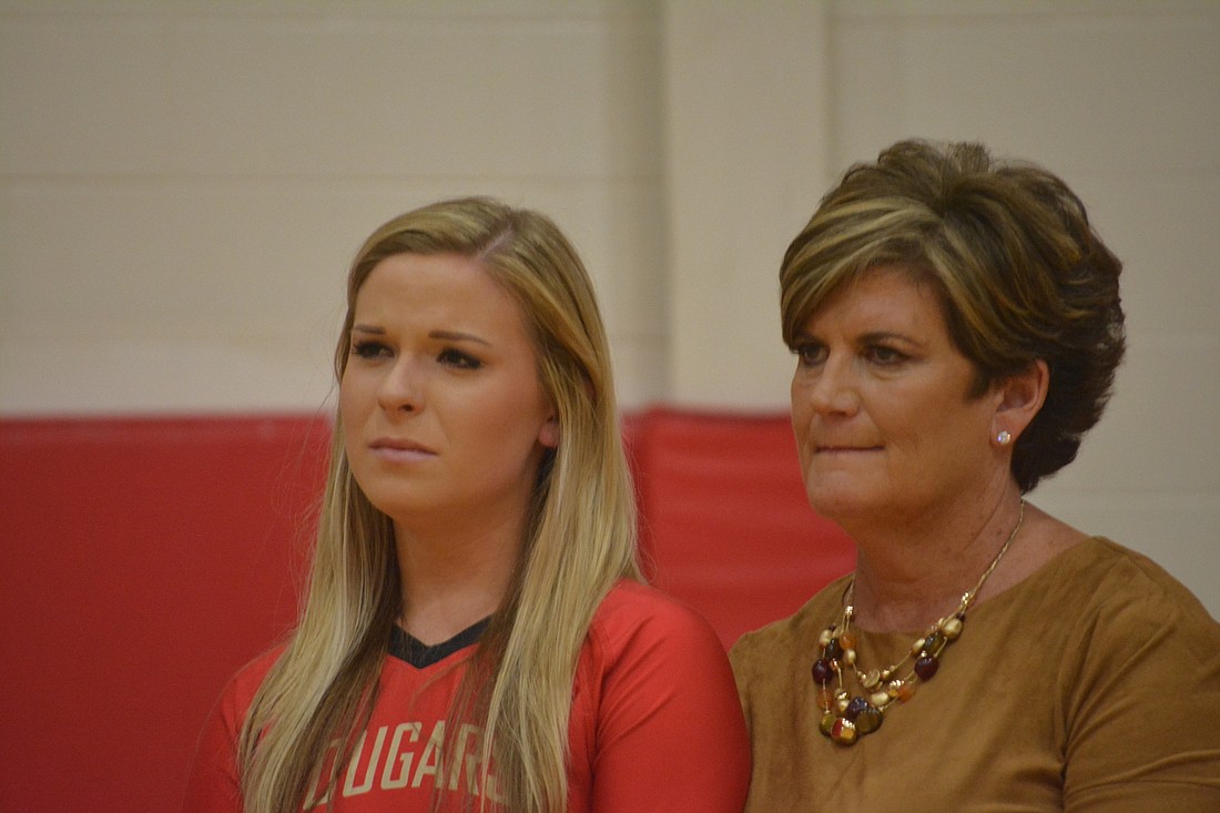 Cardinal Mooney senior setter Annie Shaw and her mother, Laurie Shaw, fight back tears during player introductions on Senior Night.