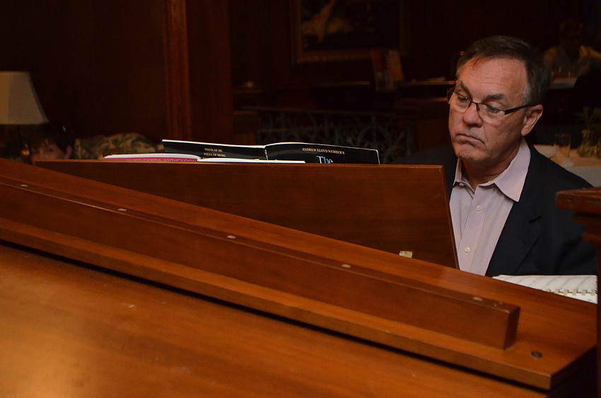 Artistic Director Joseph Holt plays the piano during a Gloria Musicae a performance at Amore by Andrea.
