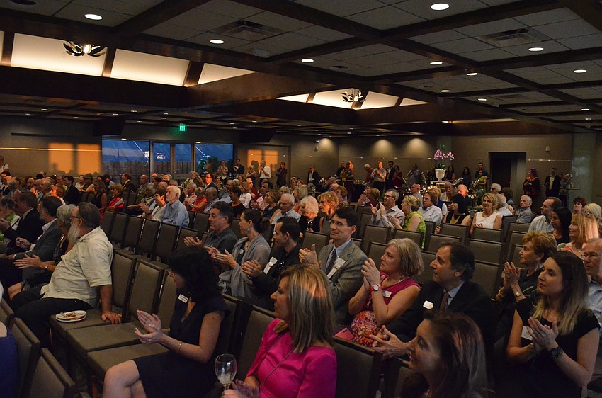 The crowd applauds as the key members of the Selby team are introduced.