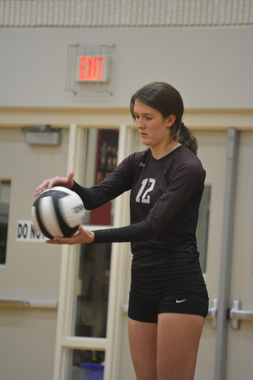 Riverview senior Courtney Searles prepares to serve in the Rams' district title match against Newsome on Oct. 20.