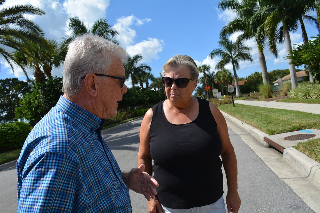 Waterlefe Community Development District Chairman Ken Bumgarner and resident Mary Lou Kovak say many residents have started using the community's back entrance, where Fort Hamer Bridge construction is underway, to avoid the detour into Waterlefe.