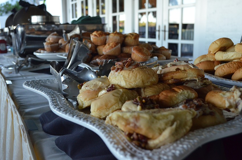 Guests dined on scrambled eggs, fruit, pastries and other breakfast items.