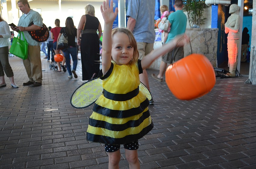 Ivy Warner, 2 ½ , flaps her “wings” during Mote’s  Night of Fish, Fun and Fright.