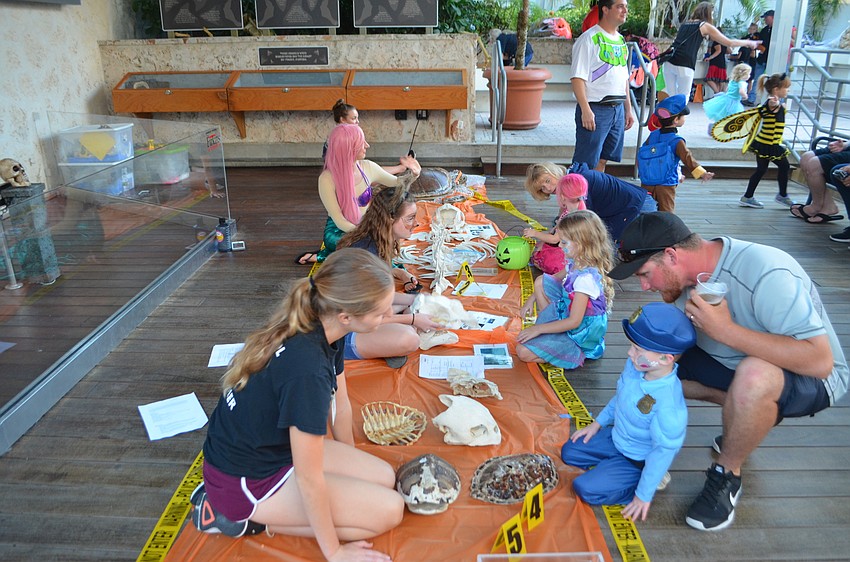 Kids play games with Mote staff during the Night of Fish, Fun and Fright on Oct. 21.