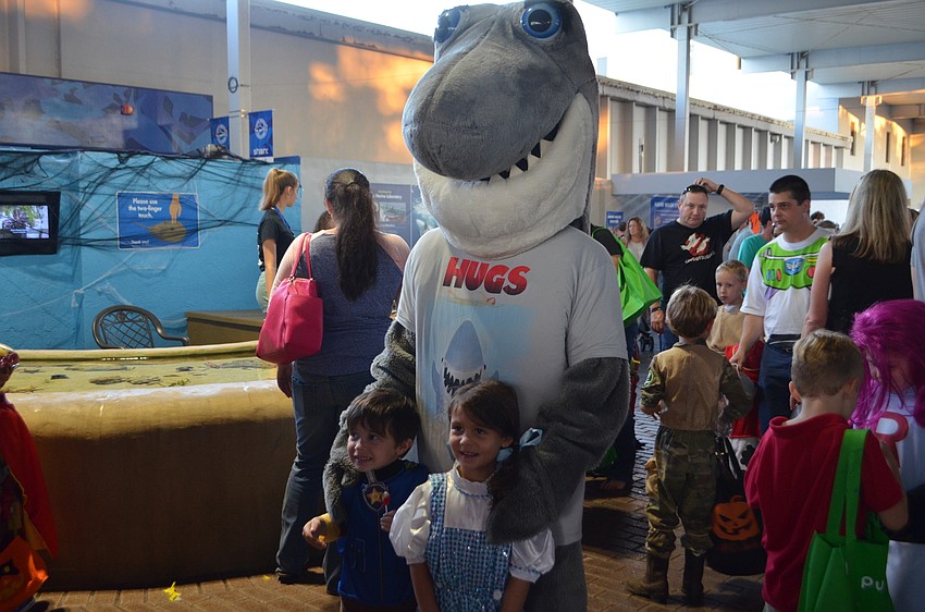 Danny Conetta, 3, and Payton Stewart, 4, stand with Gilly the Shark at Mote’s Night of Fish, Fun and Fright.