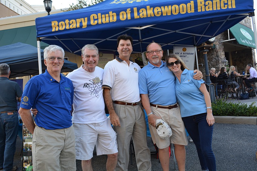 Rotary Club of Lakewood Ranch members Dee McSweeney, Ted Lindenberg, Steve Bordes, Bill Porter and Susan Courter were eager to tell the public about their upcoming Suncoast Food and Wine Festival.