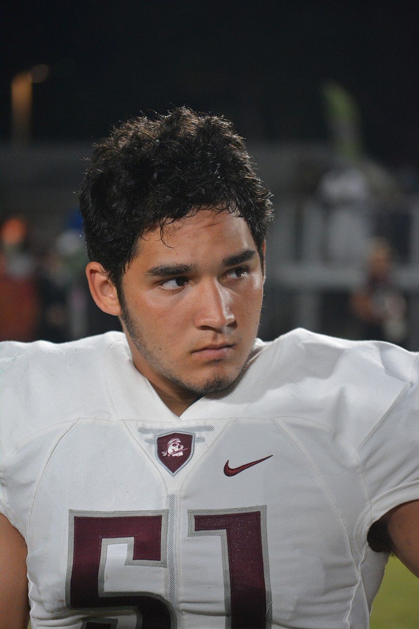 Braden River senior linebacker Noah Arce listens to the officials before the coin toss for the Pirates' game against Palmetto on Oct. 21. Braden River would go on to win 35-0.