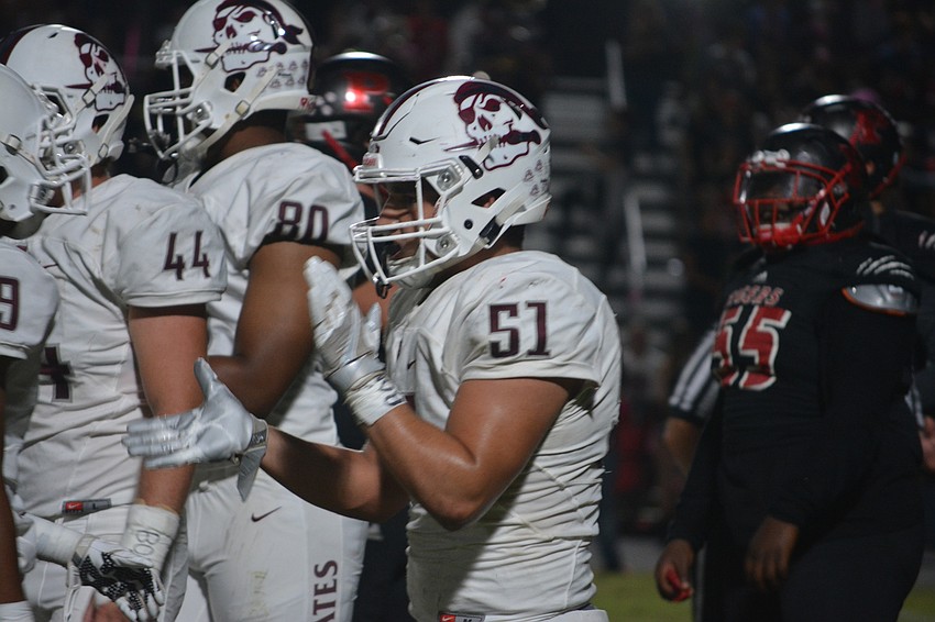 Braden River senior linebacker Noah Arce claps for his teammates during his team's 35-0 win over Palmetto on Oct. 21.