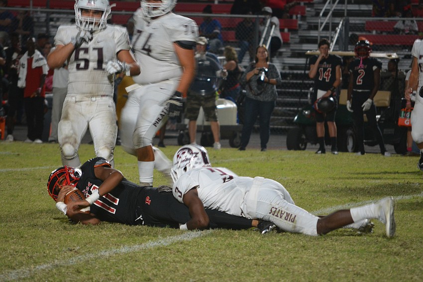 Braden River senior defensive back/linebacker Devontay Seabrooks brings down a Palmetto ballcarrier during the Pirates' 35-0 win on Oct. 21.