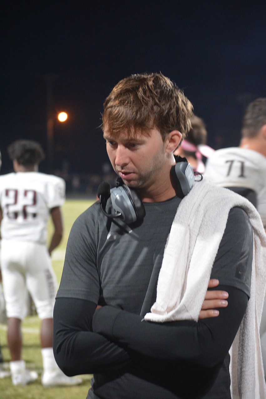 Braden River offensive coordinator Eric Sanders talks to his unit on the bench during the Pirates' 35-0 win over Palmetto on Oct. 21.