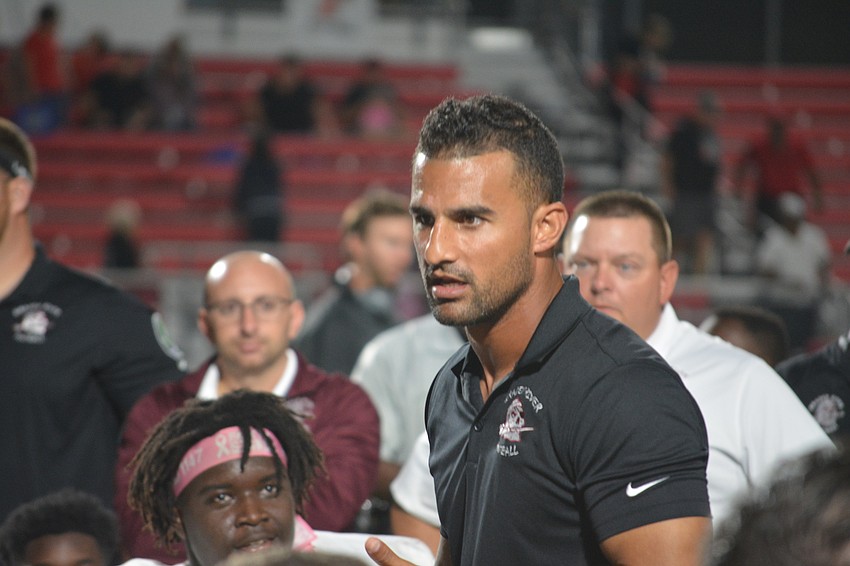 Braden River head coach Curt Bradley speaks to his team following its 35-0 win over Palmetto on Oct. 21.