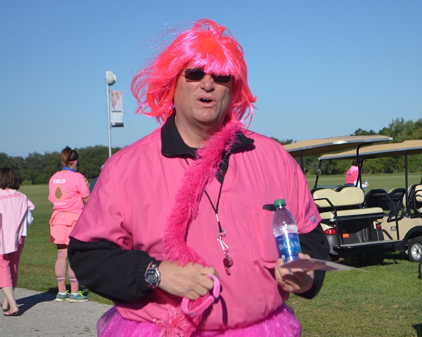 Parrish's Scot Cranston, 53, sports a pink wig and scarf during the Strides Against Breast Cancer Walk.