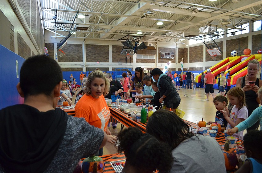 Games and activity booths were set up inside the gymnasium for families to enjoy.