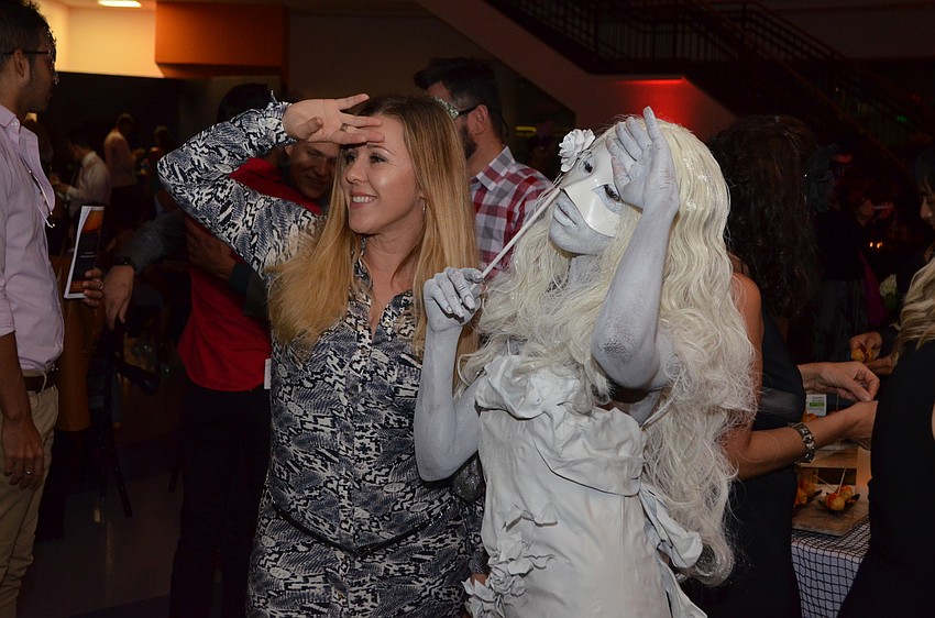 Edit Szegedi poses with one of the live mannequins.