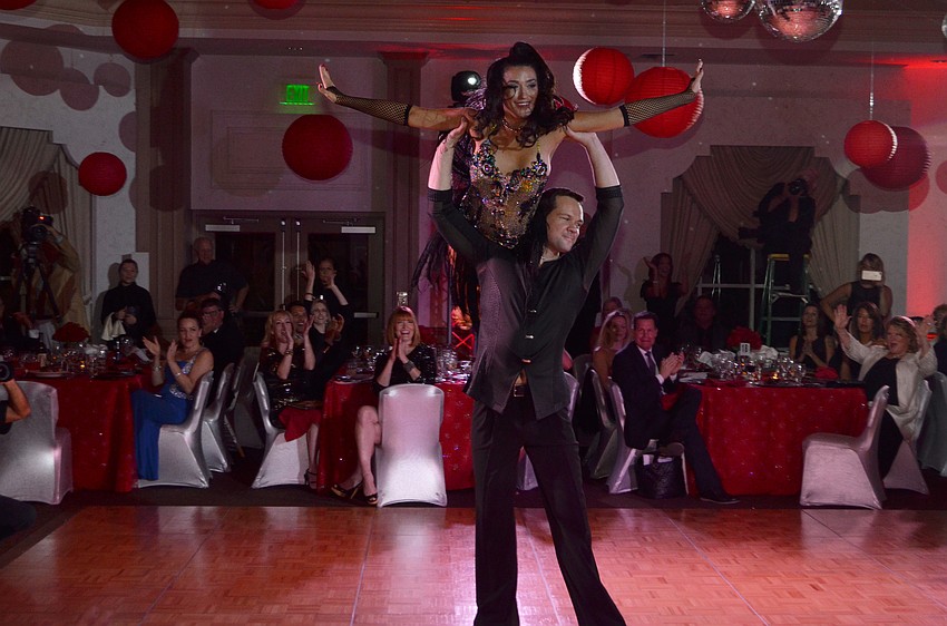 Ashley Guttridge is lifted by partner Sid Pocius.