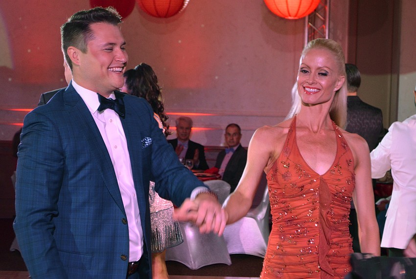 Bart Lowther laughs as he takes the floor with partner Sonia Ragan for a foxtrot to start off the night.