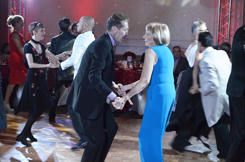 James Helmich dances with Gloria Moss.