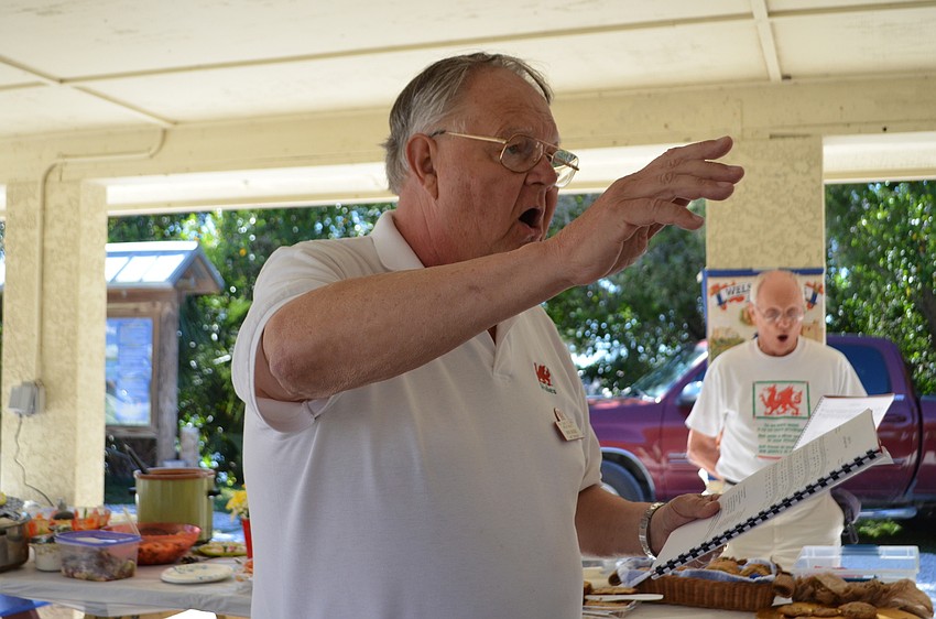 Club founder Don Hughes leads the crowd in Welsh hymns.
