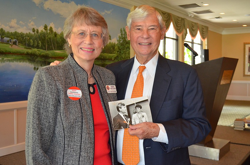 Sarasota County Tax Collector candidate Barbara Ford-Coates and Senator Graham with a photo of Graham endorsing Ford-Coates for tax collector in 1984.