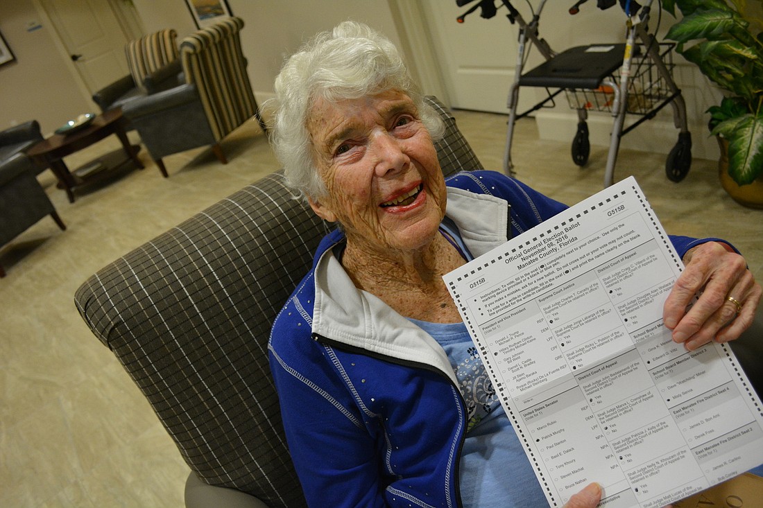 Miriam Hosack completes her ballot by casting her presidential vote for Hillary Clinton. She never thought she'd live to see a woman run for president.
