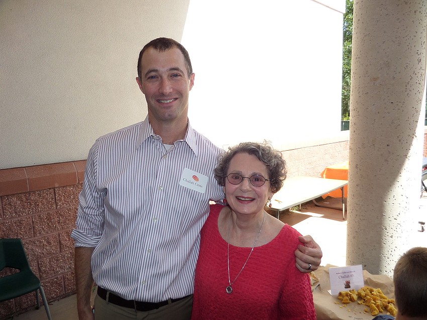 Head of School Dan Ceaser poses with second-place-winner Marge Elin.